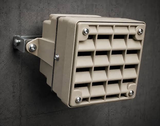 Wall-mounted anti-loitering sound device installed on a concrete wall